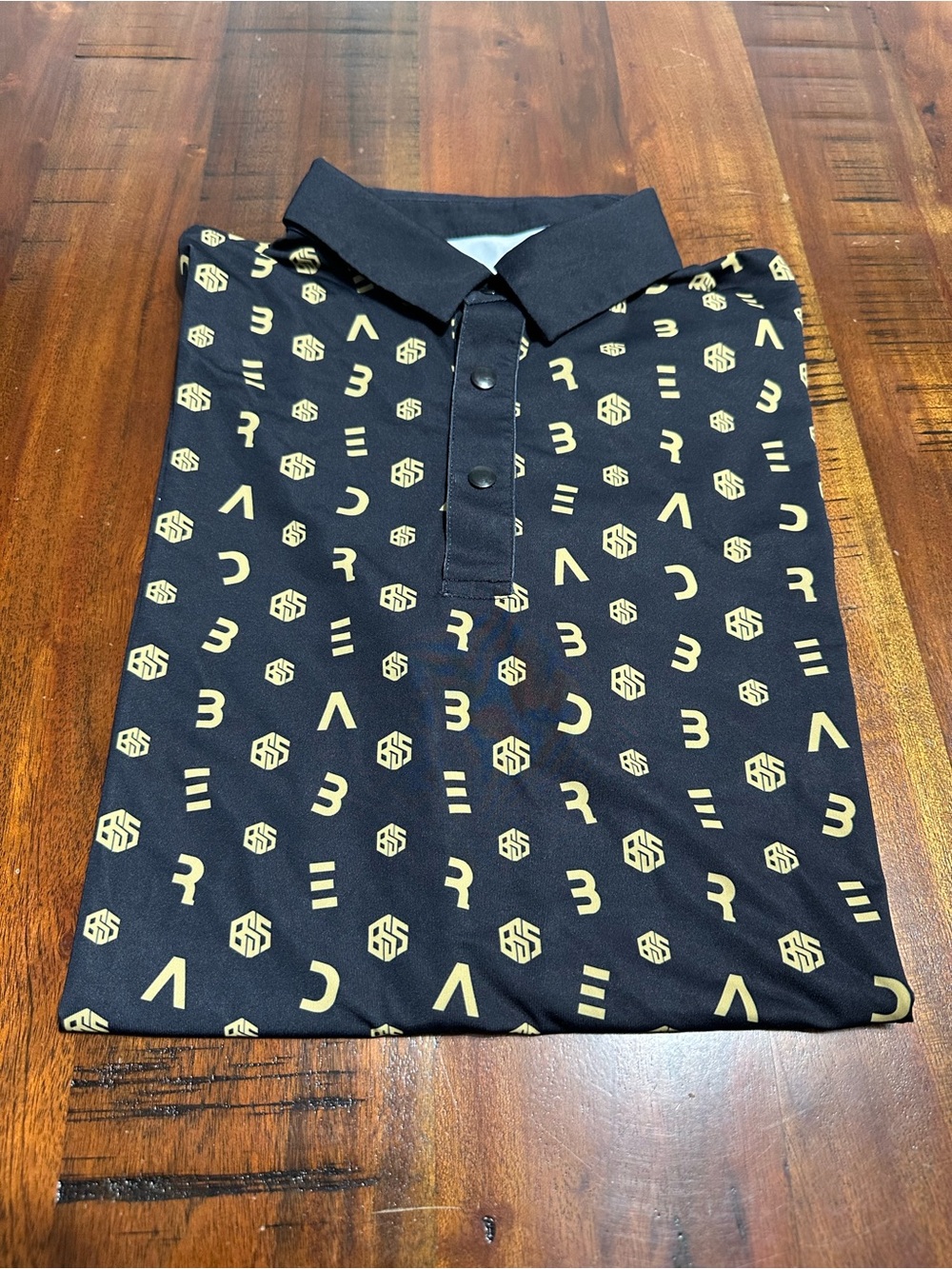 Men's Black Golf Polo Shirt with Gold Geometric Print